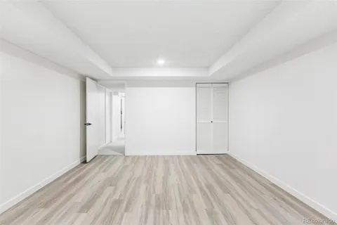 a view of a room with wooden floor