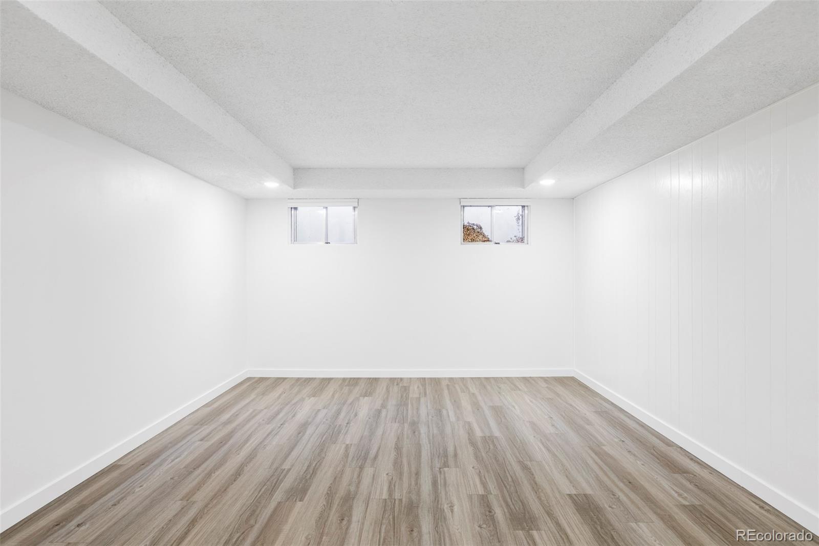 6000 West Mansfield Avenue, Unit 12 Denver, CO 80235 - Photo 34 of 41 a view of a room with wooden floor