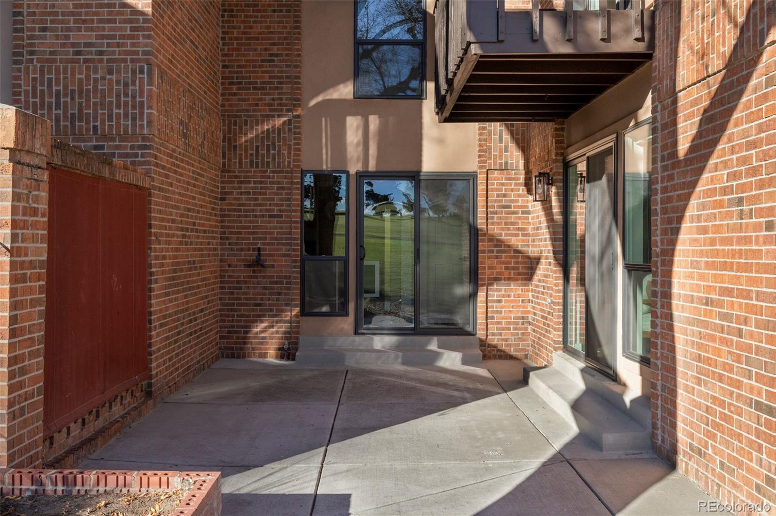 6000 West Mansfield Avenue, Unit 12 Denver, CO 80235 - Photo 36 of 41 a view of entrance door of the house