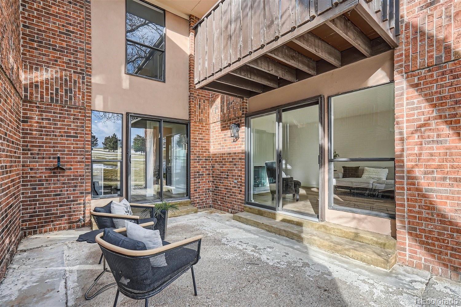 6000 West Mansfield Avenue, Unit 12 Denver, CO 80235 - Photo 37 of 41 a outdoor space with patio furniture and a potted plant