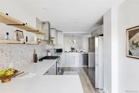 a kitchen with cabinets and window