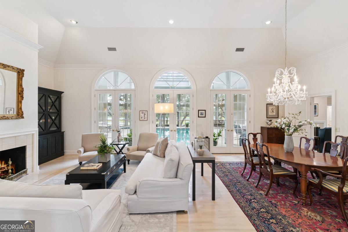 160 Hampton Point Drive St. Simons Island, GA 31522 - Photo 13 of 59 a living room with furniture chandelier and a fireplace