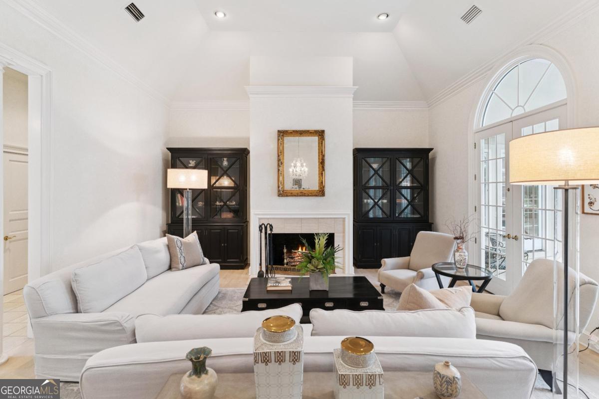 160 Hampton Point Drive St. Simons Island, GA 31522 - Photo 14 of 59 a living room with furniture fireplace and a large window
