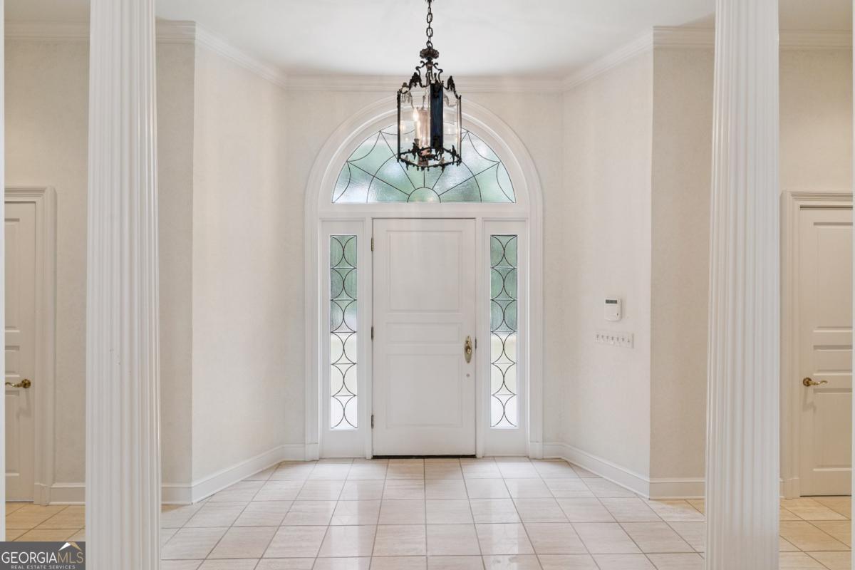 160 Hampton Point Drive St. Simons Island, GA 31522 - Photo 17 of 59 a view of a hallway with windows