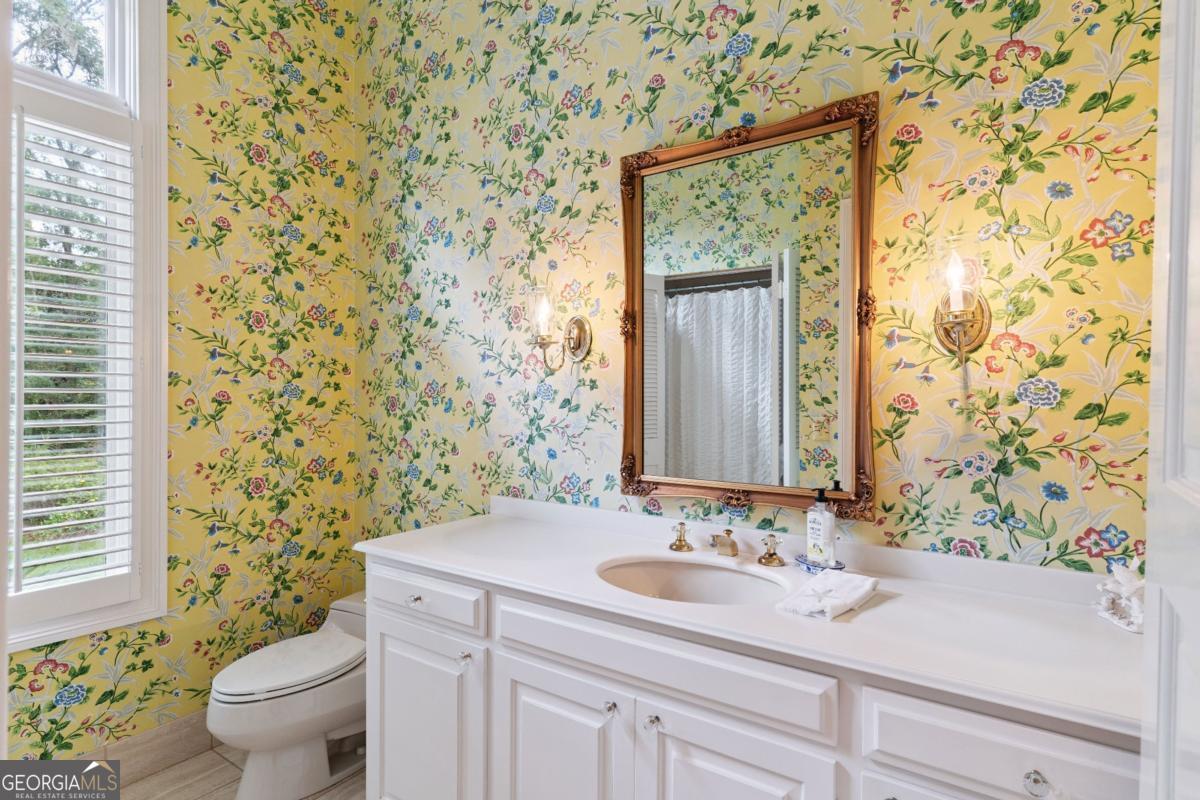 160 Hampton Point Drive St. Simons Island, GA 31522 - Photo 19 of 59 a bathroom with a sink and a mirror