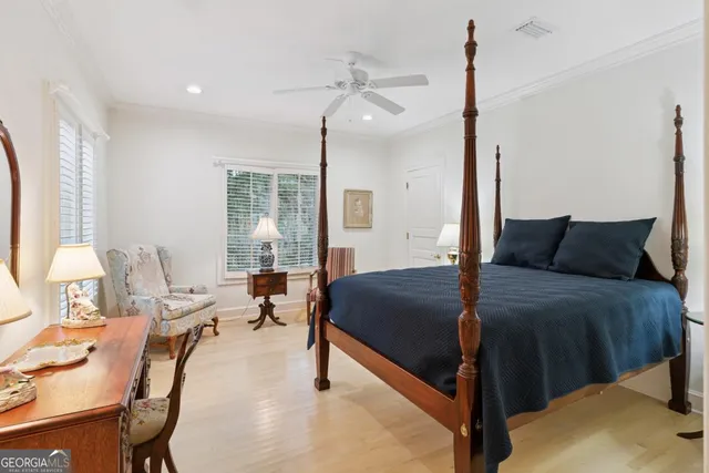 a living room with furniture a rug and a large window