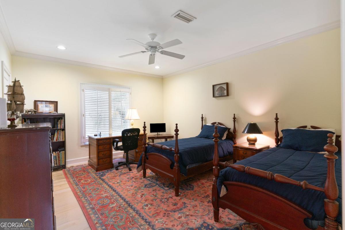 160 Hampton Point Drive St. Simons Island, GA 31522 - Photo 23 of 59 a living room with furniture and a chandelier