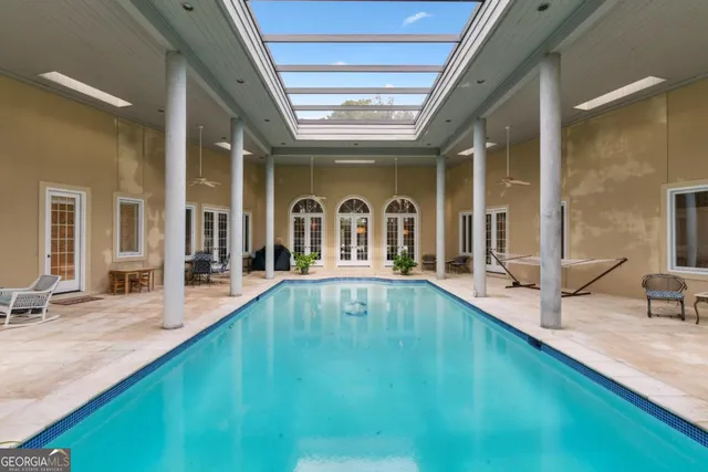 a kitchen with stainless steel appliances a refrigerator sink and cabinets