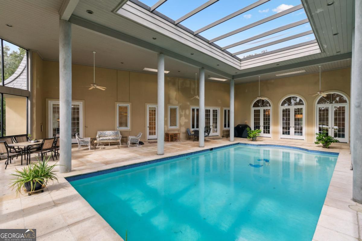 160 Hampton Point Drive St. Simons Island, GA 31522 - Photo 29 of 59 a view of swimming pool with outdoor seating