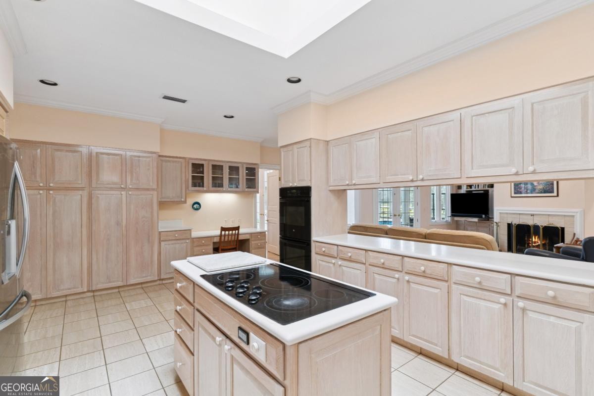 160 Hampton Point Drive St. Simons Island, GA 31522 - Photo 34 of 59 a kitchen with white cabinets and appliances