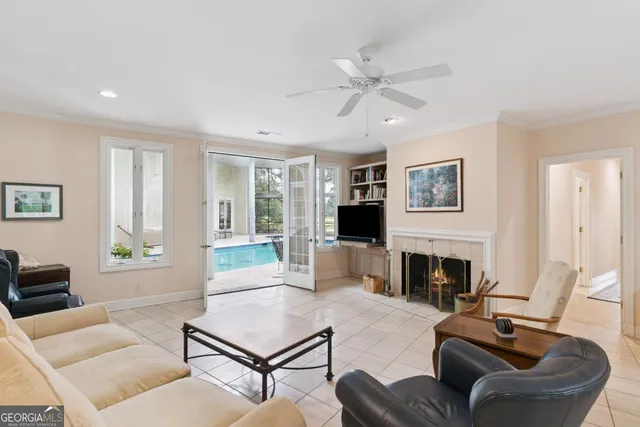 a living room with a bed furniture and a window