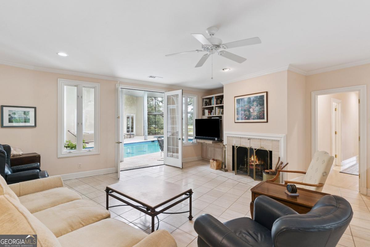 160 Hampton Point Drive St. Simons Island, GA 31522 - Photo 37 of 59 a living room with furniture and a fireplace