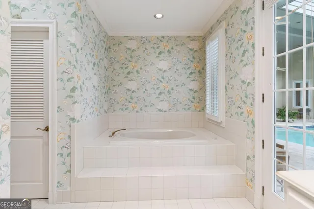 a view of a house with wooden fence