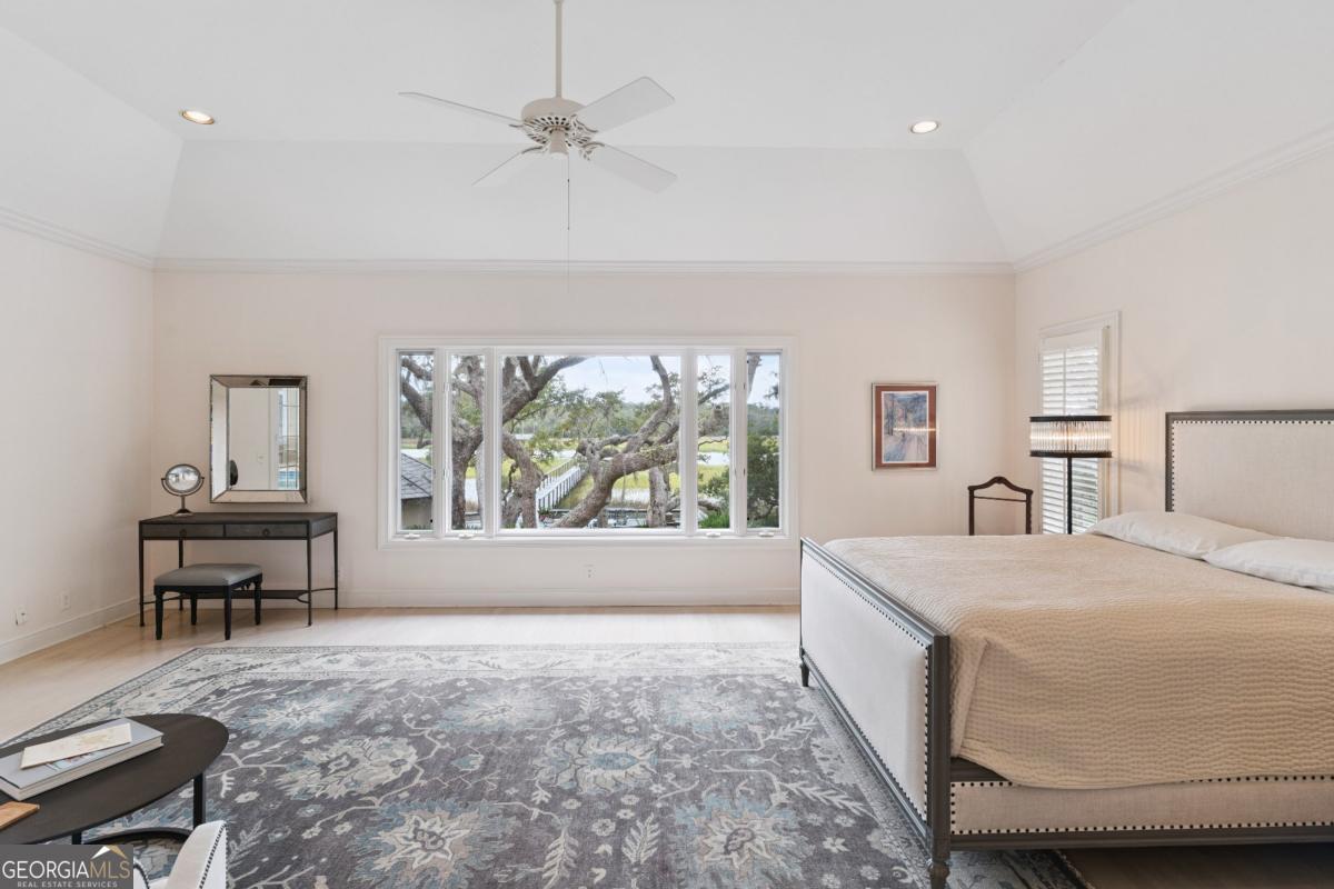 160 Hampton Point Drive St. Simons Island, GA 31522 - Photo 42 of 59 a living room with a bed furniture and a window