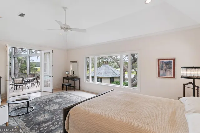 a view of a patio with table and chairs and wooden floor