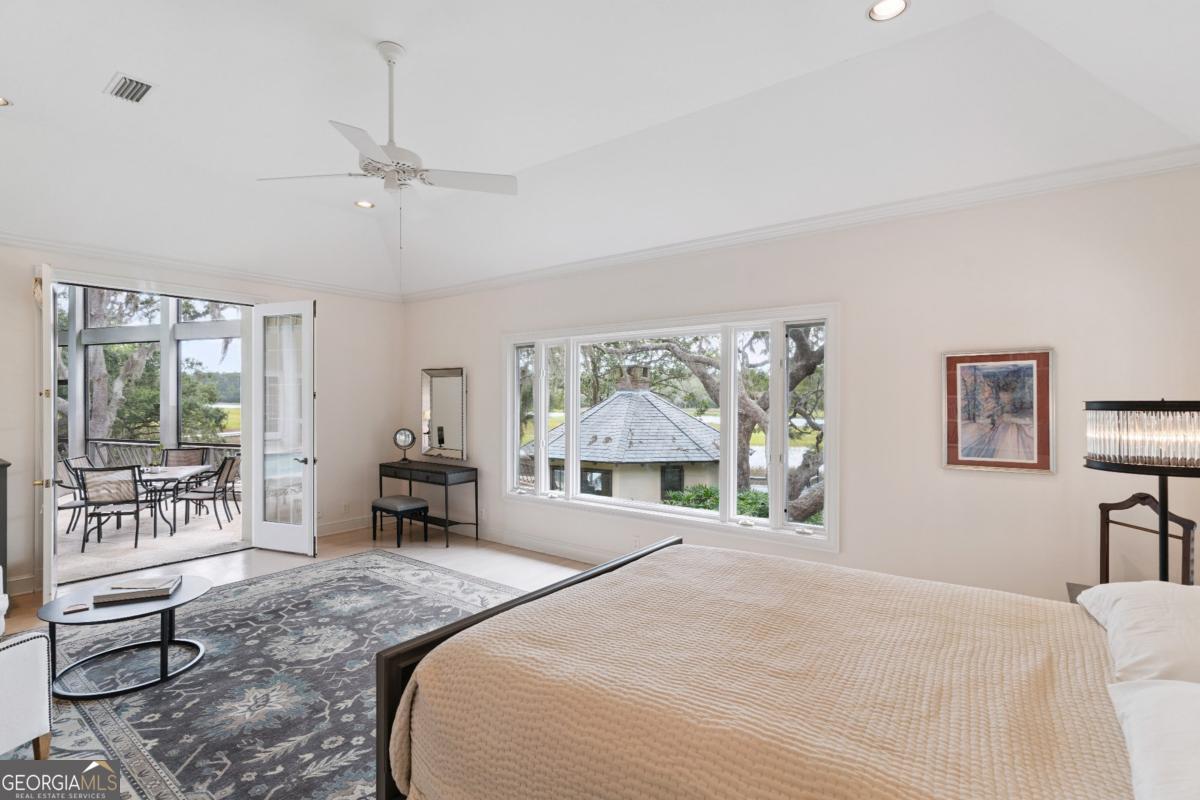 160 Hampton Point Drive St. Simons Island, GA 31522 - Photo 43 of 59 a bed room with a bed and a large window