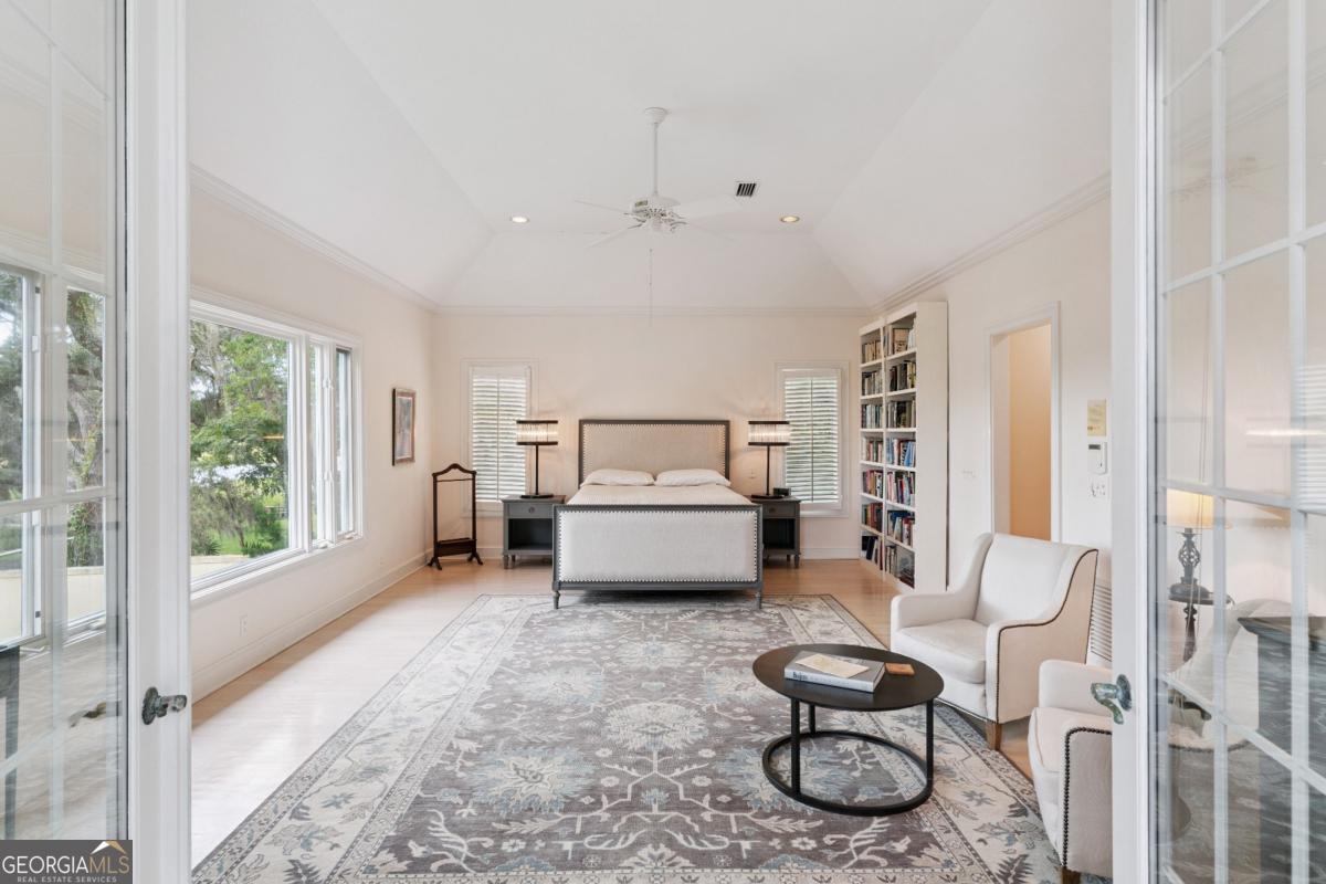 160 Hampton Point Drive St. Simons Island, GA 31522 - Photo 44 of 59 a bedroom with furniture and a window