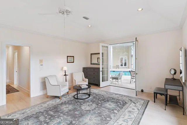 a view of an ocean with a table and chairs