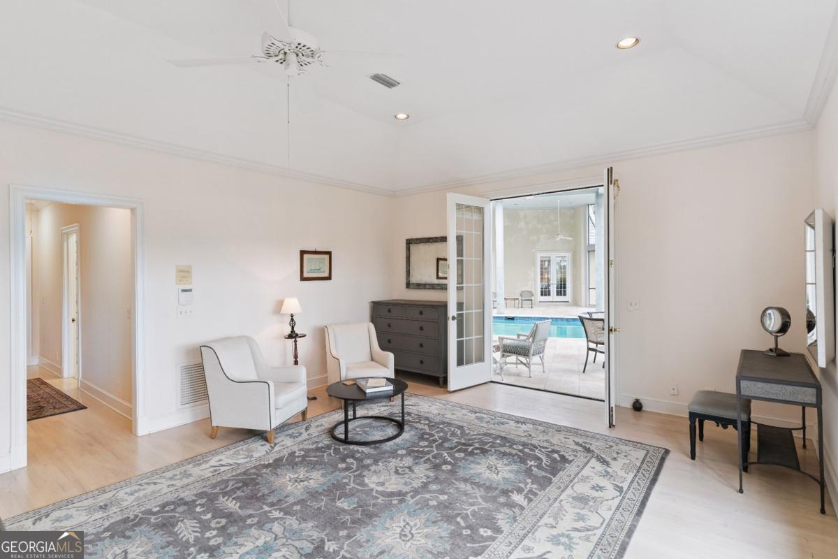 160 Hampton Point Drive St. Simons Island, GA 31522 - Photo 45 of 59 a living room with furniture and a rug