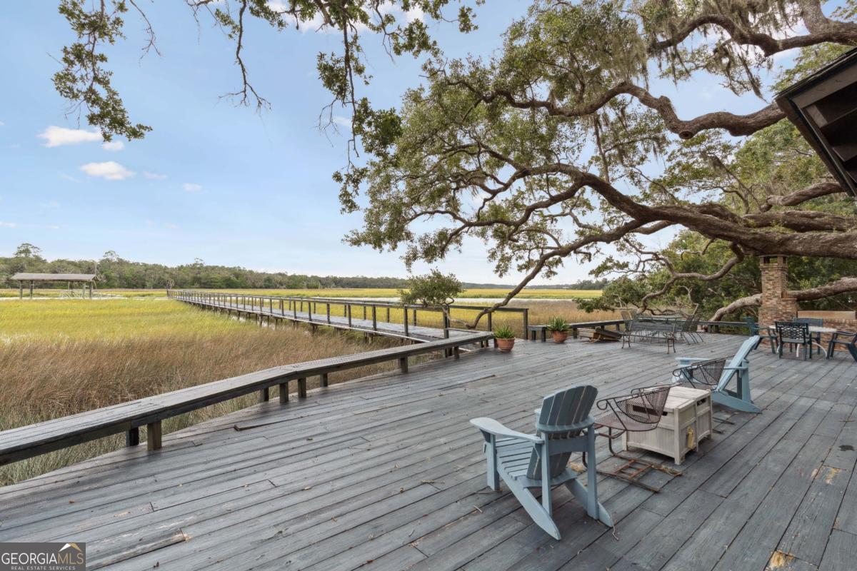 160 Hampton Point Drive St. Simons Island, GA 31522 - Photo 48 of 59 a view of a lake with outdoor seating space