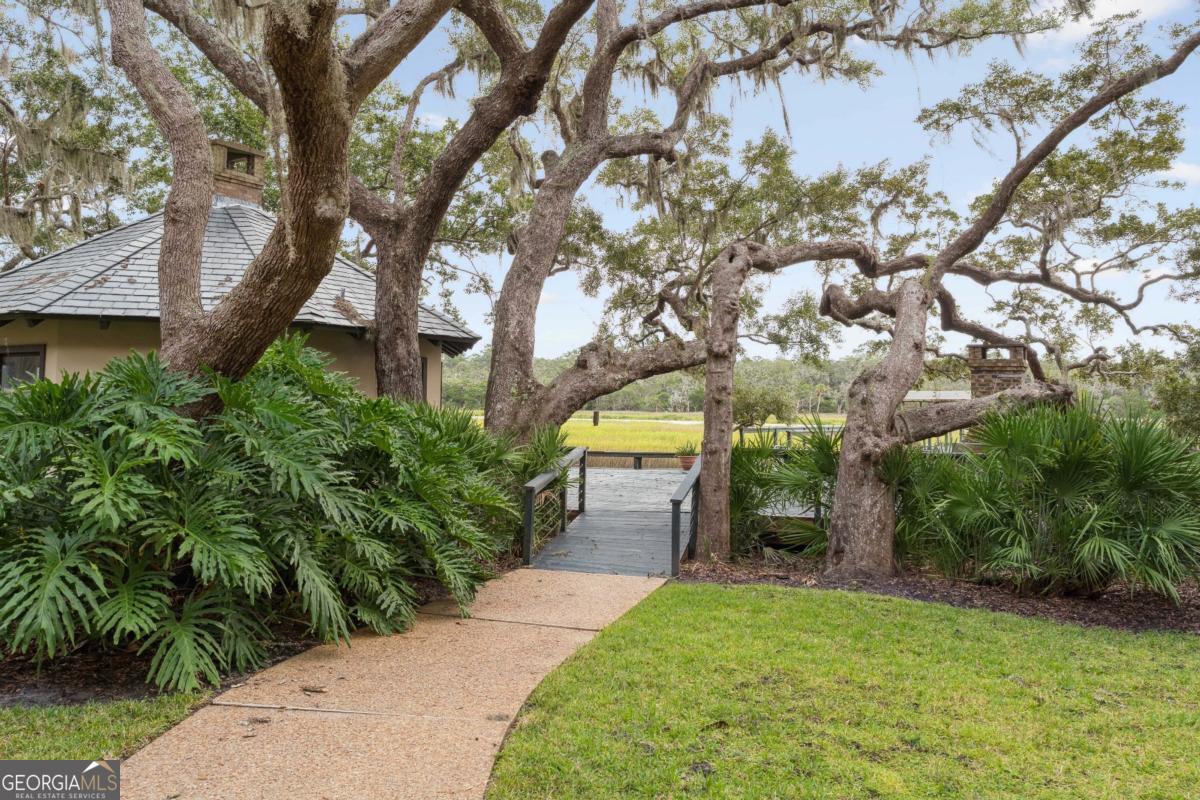 160 Hampton Point Drive St. Simons Island, GA 31522 - Photo 51 of 59 a backyard of a house with lots of green space