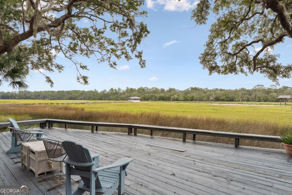 160 Hampton Point Drive St. Simons Island, GA 31522 - Photo 52 of 59 a view of an ocean with a table and chairs