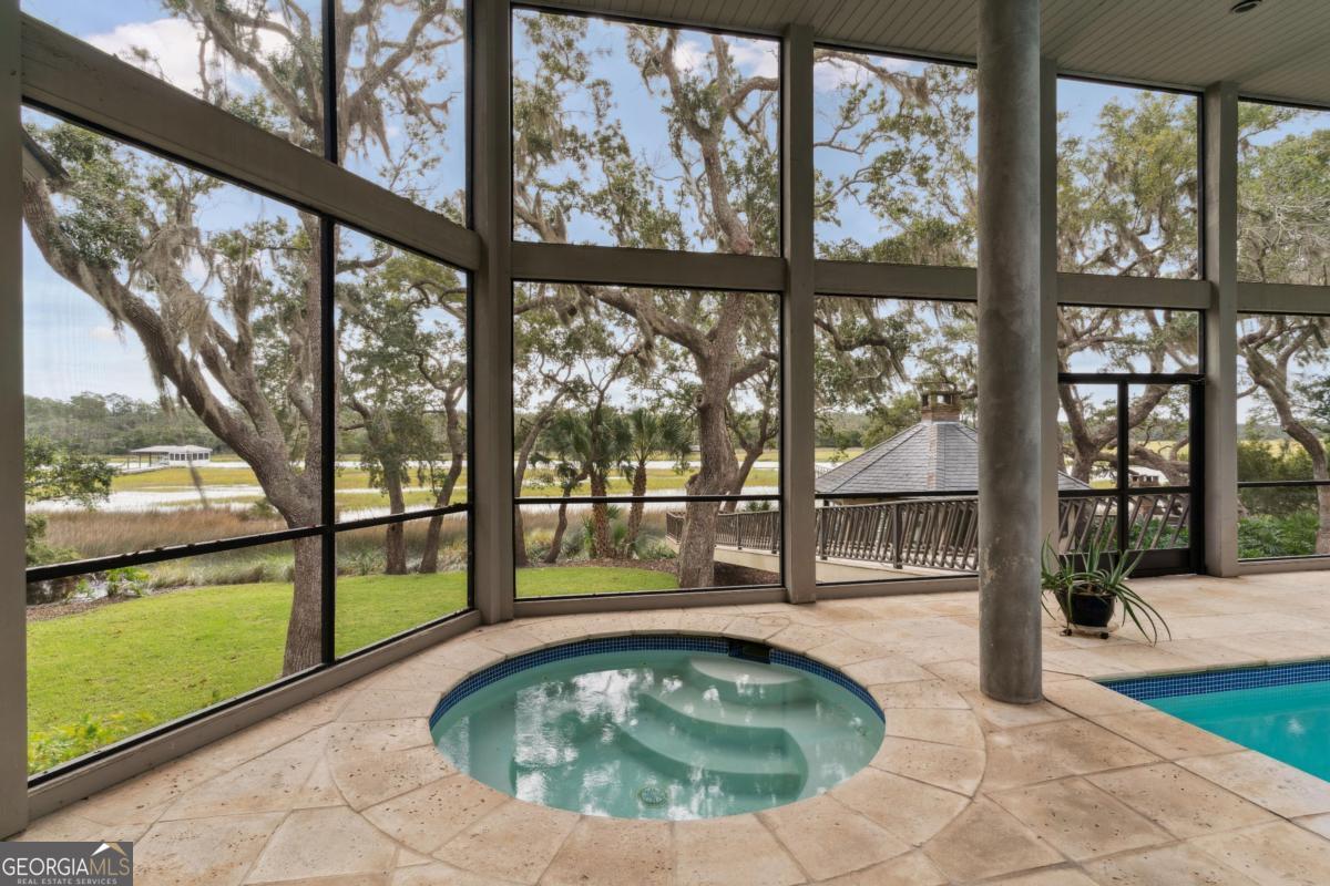 160 Hampton Point Drive St. Simons Island, GA 31522 - Photo 7 of 59 a view of a swimming pool with an outdoor seating space