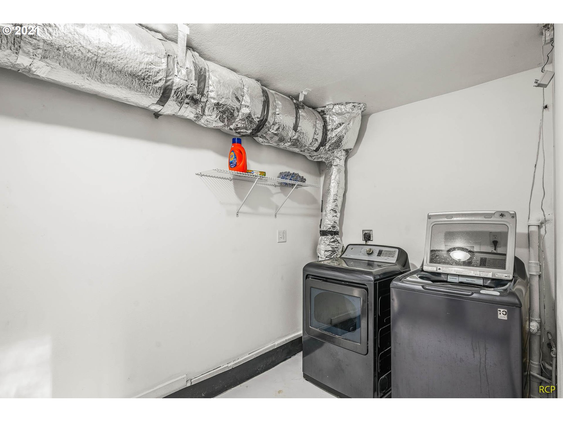6732 Southeast Telford Road Gresham, OR 97080 - Photo 14 of 27 a utility room with dryer washer and stair