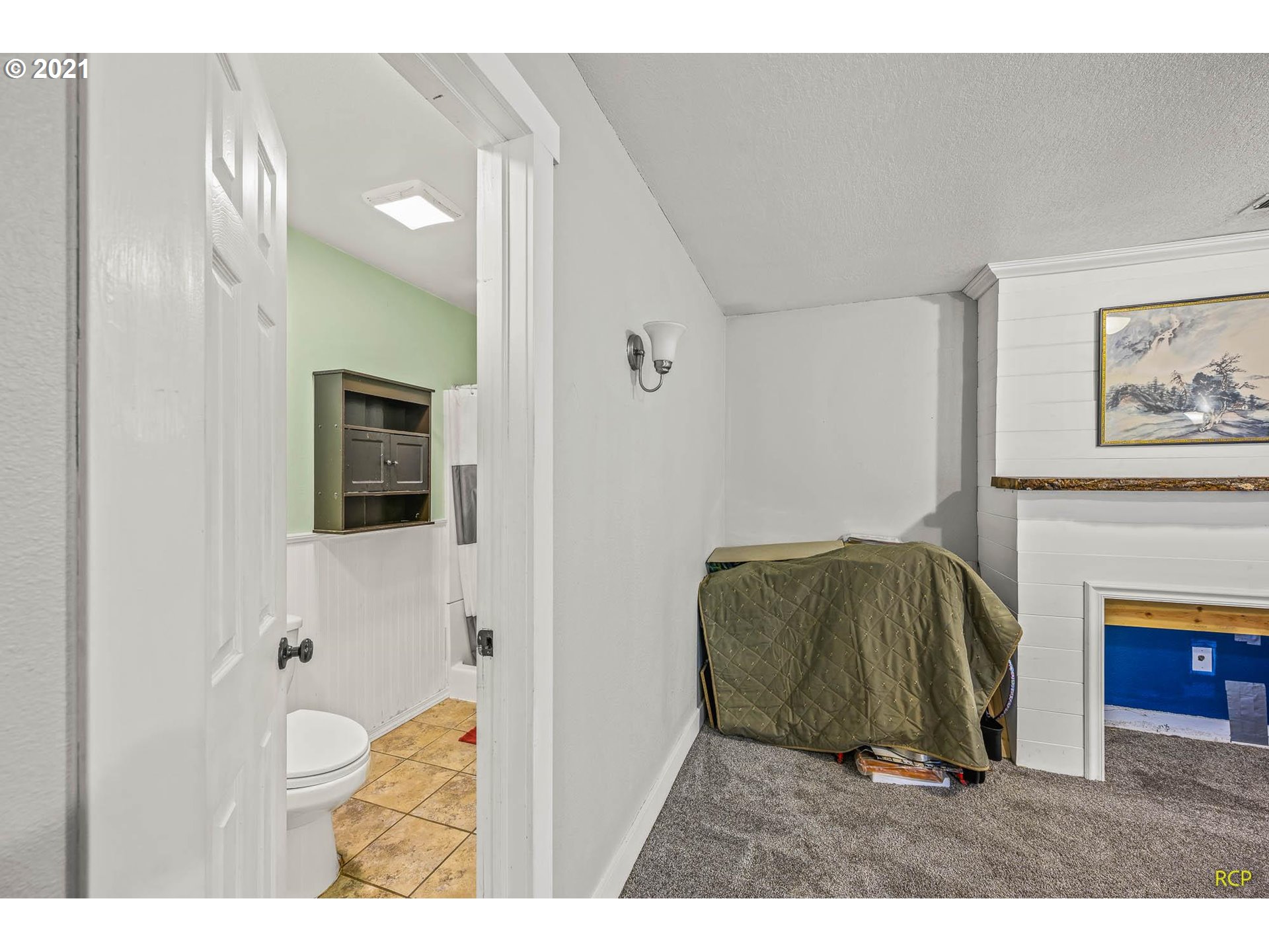 6732 Southeast Telford Road Gresham, OR 97080 - Photo 19 of 27 a living room with furniture and a fireplace