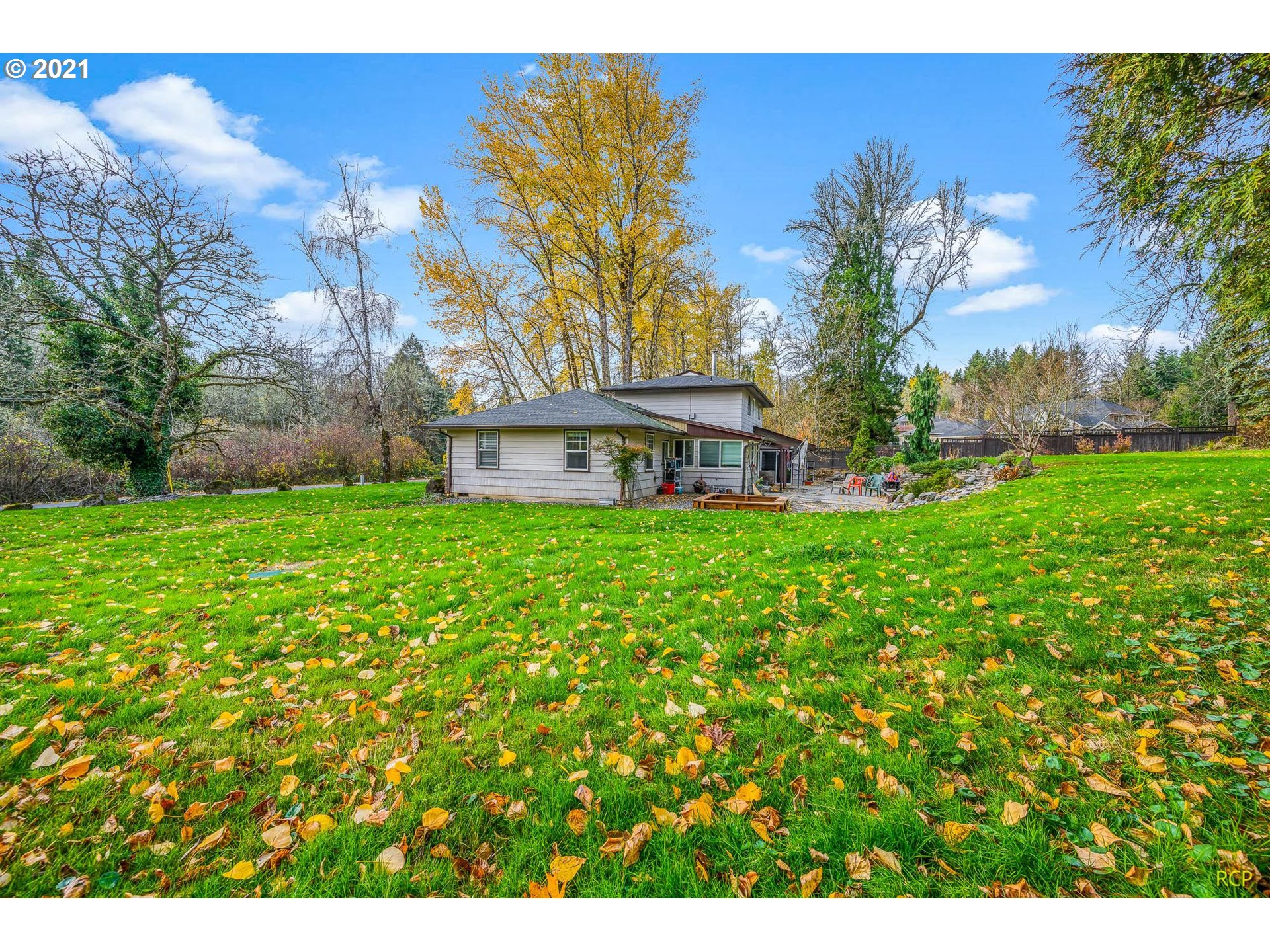 6732 Southeast Telford Road Gresham, OR 97080 - Photo 25 of 27 a view of a house with a big yard and potted plants