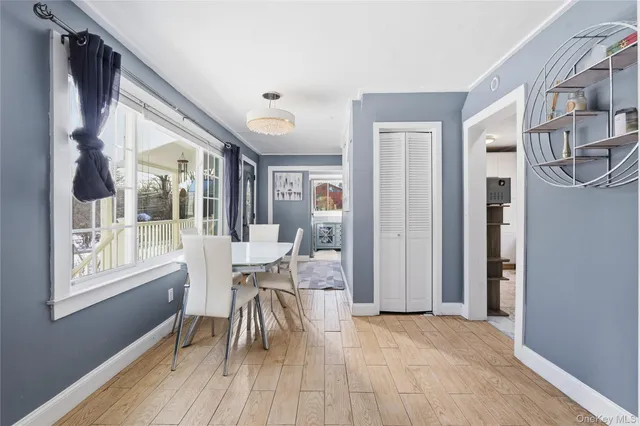 a dining room with furniture and wooden floor