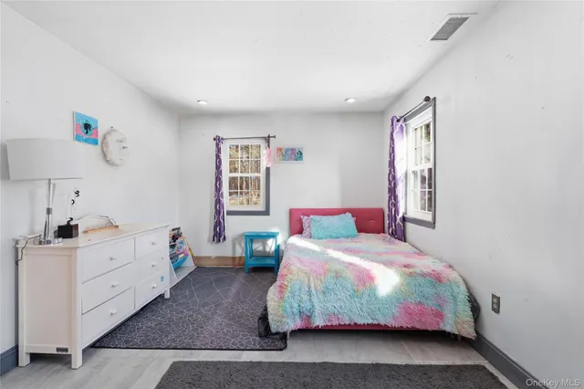 a bedroom with a bed and a cabinets