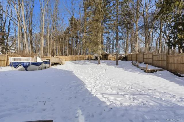 a view of white house with a bed