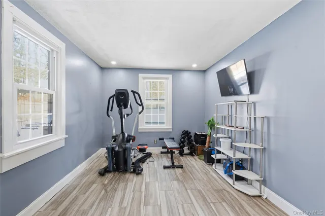 a view of a livingroom with furniture and a window