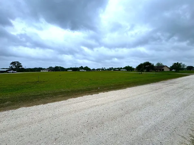 a view of a golf course with a lake