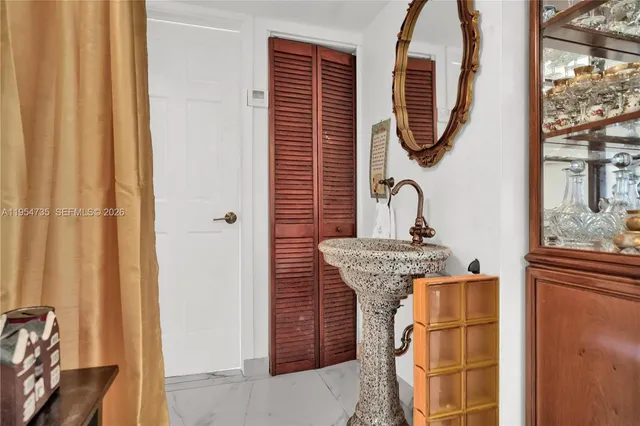 a kitchen with stainless steel appliances granite countertop a stove a sink a microwave and cabinets