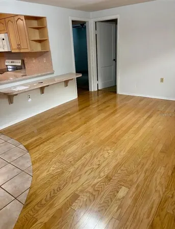a view of a house with yard and sitting area