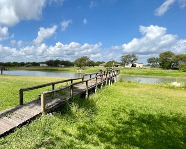25051 Lake Shore Drive Mathis, TX 78368 - Photo 37 of 40 a view of a lake with houses in the back