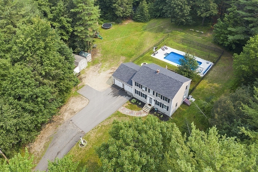 47 Brooks Village Road Phillipston, MA 01331 - Photo 4 of 41 an aerial view of a house with a garden and lake view
