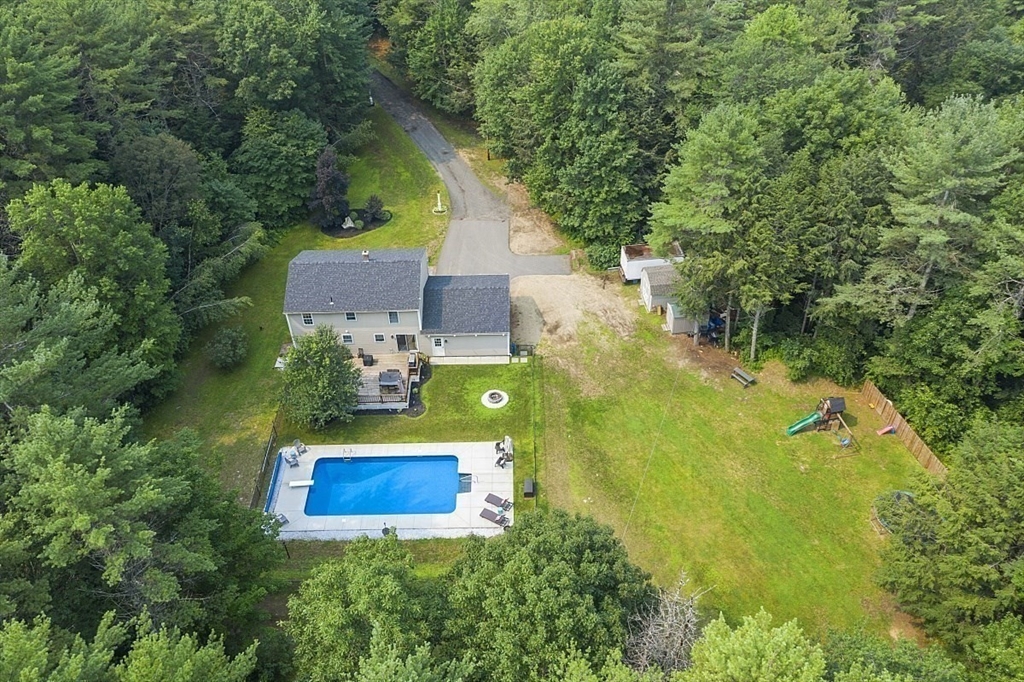 47 Brooks Village Road Phillipston, MA 01331 - Photo 5 of 41 an aerial view of a house with swimming pool and large trees