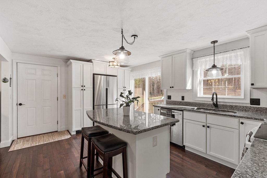 47 Brooks Village Road Phillipston, MA 01331 - Photo 6 of 41 a kitchen with granite countertop a sink cabinets and wooden floor