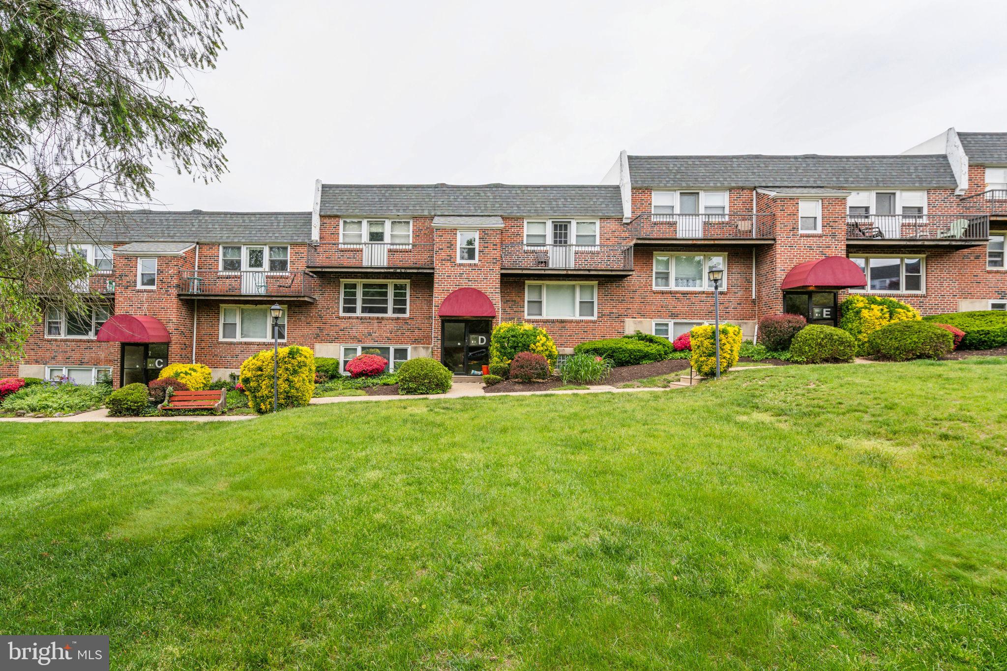 6901 Valley Avenue, Unit D1 Philadelphia, PA 19128 - Photo 18 of 19 a front view of building with play ground and yard