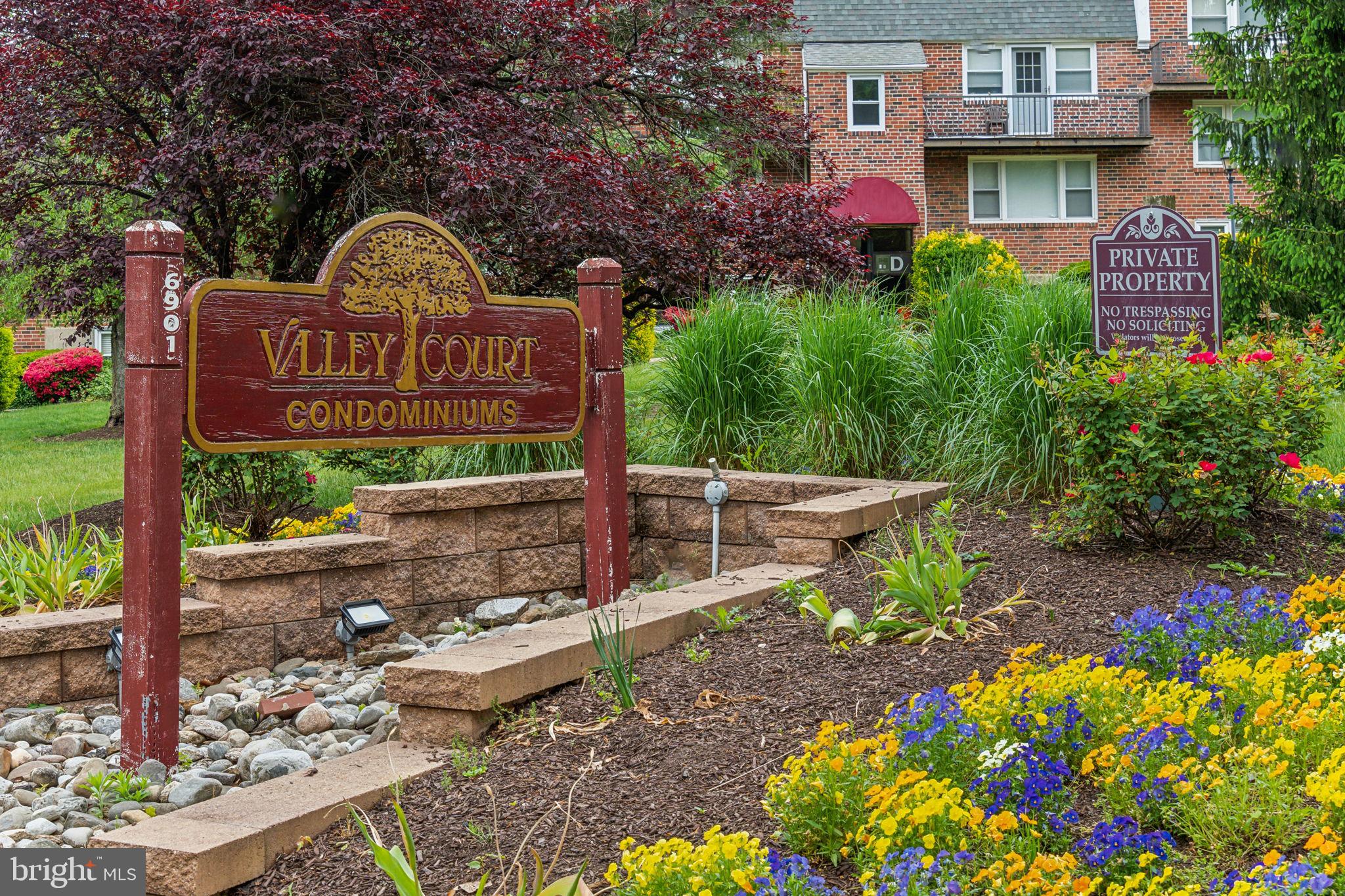 6901 Valley Avenue, Unit D1 Philadelphia, PA 19128 - Photo 19 of 19 a front view of a house with a yard