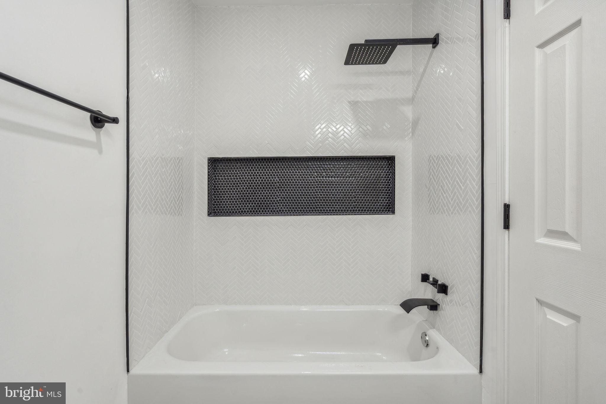 6901 Valley Avenue, Unit D1 Philadelphia, PA 19128 - Photo 8 of 19 a bathroom with a bathtub