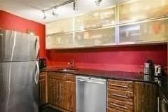 a bathroom with a granite countertop shower and a sink