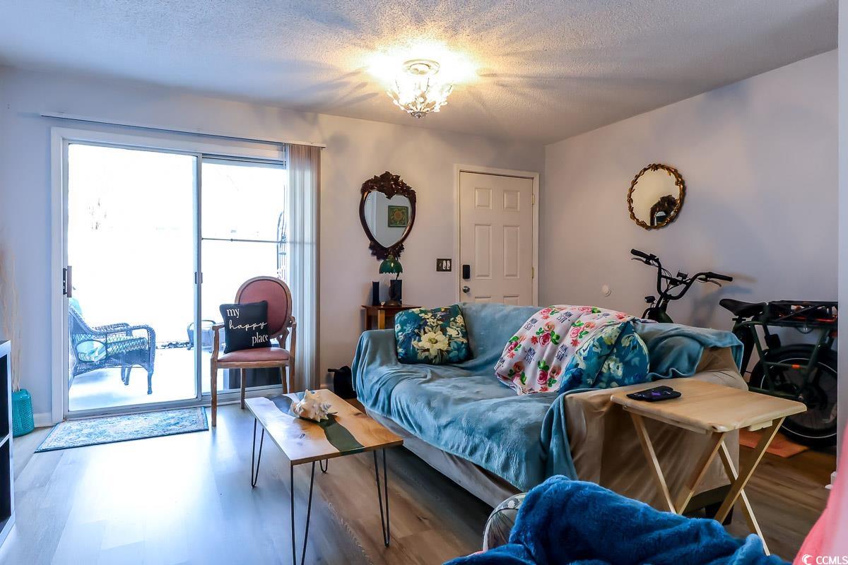 401 Cambridge Circle, Unit A1 Murrells Inlet, SC 29576 - Photo 11 of 15 Bedroom featuring a spacious closet, wood finished