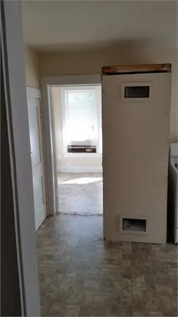 a view of a refrigerator in a kitchen
