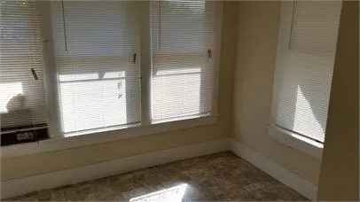 a view of an empty room and window
