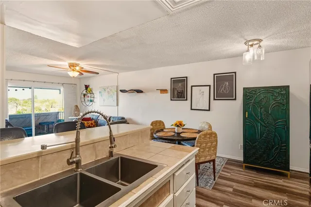 a kitchen with a sink and a refrigerator