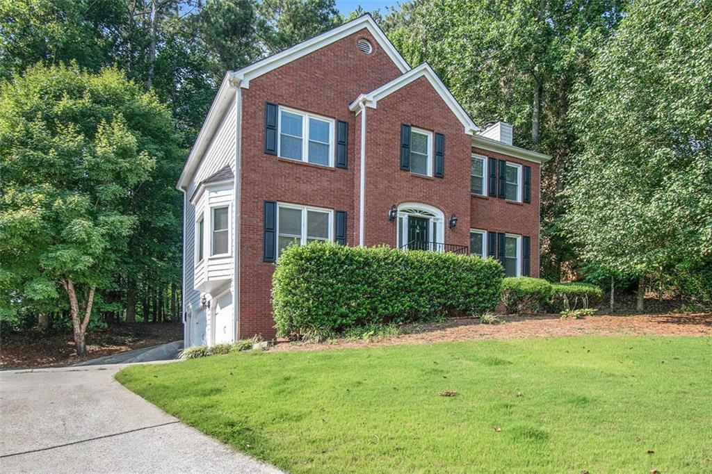 2264 Northbrook Ridge Northwest Kennesaw, GA 30152 - Photo 1 of 1 a front view of a house with a yard